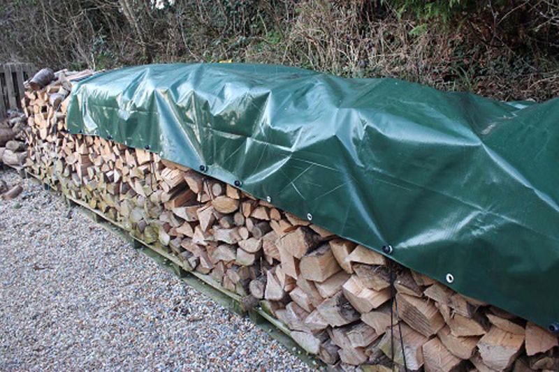 tarpaulin placed over logs
