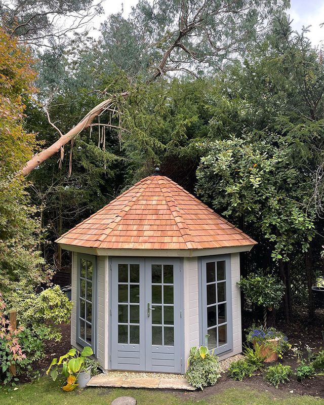 small summerhouse with shingle roof